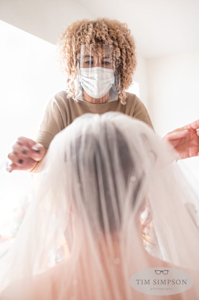 wedding make up artist in face mask