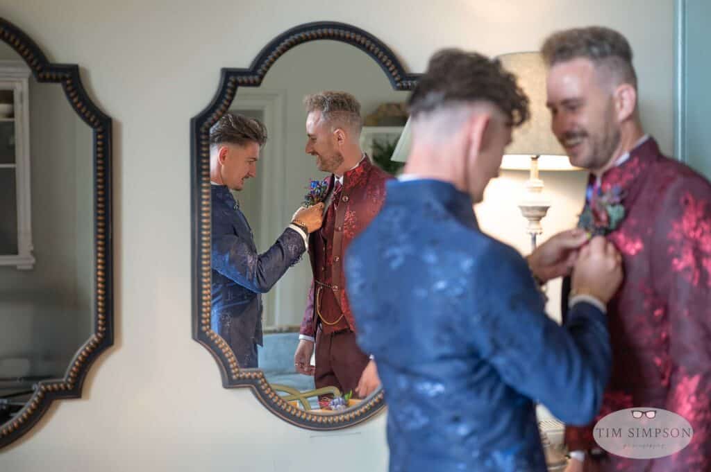 two grooms preparing for a wedding